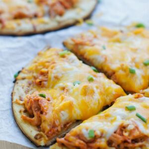 Close up photo of a slice of buffalo chicken pizza.